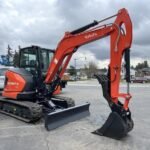 2026 Kubota KX057-5  includes heat, A/C, angle blade, 2X AUX hydraulics, coupler, hydraulic thumb, dig bucket